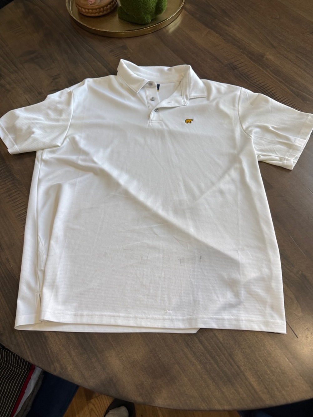 Men's White Polo Shirt with Small Yellow Embroidered Motif